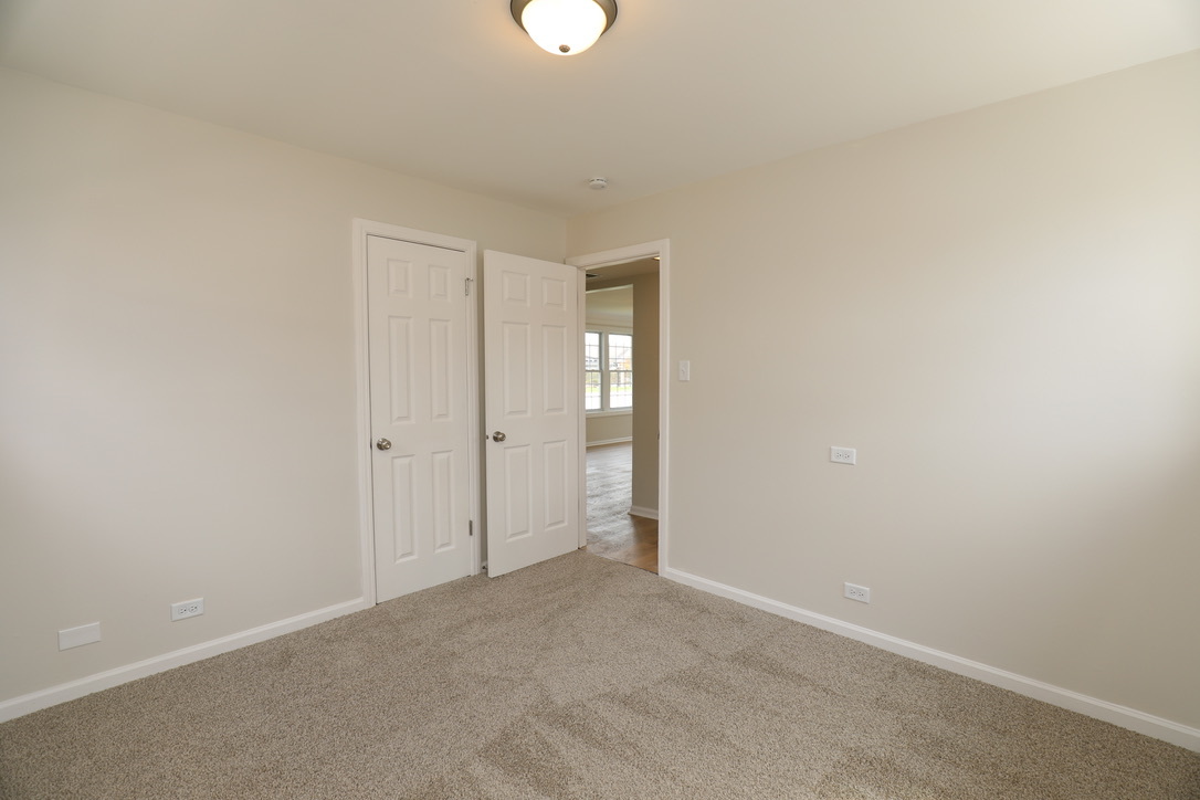 2207 175th Street Homewood, IL 60430 - Photo 6 of 13 a view of an empty room and window