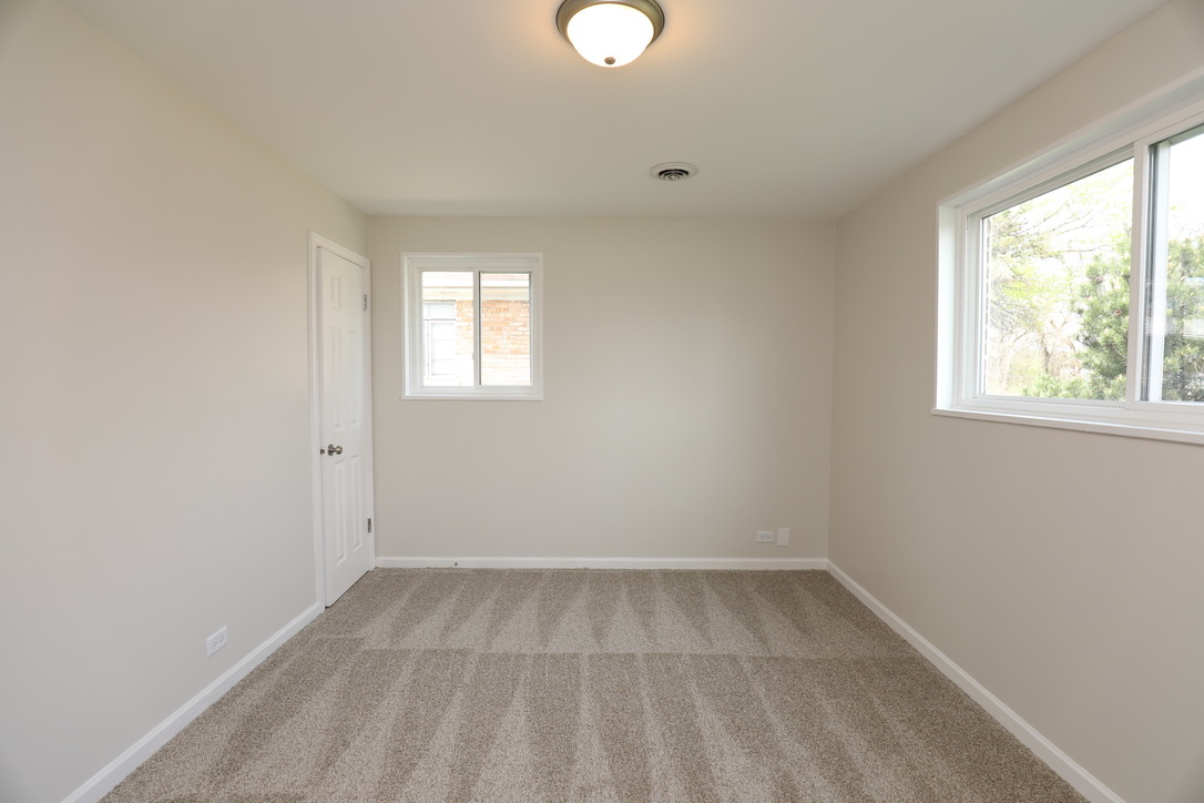 2207 175th Street Homewood, IL 60430 - Photo 8 of 13 an empty room with a window
