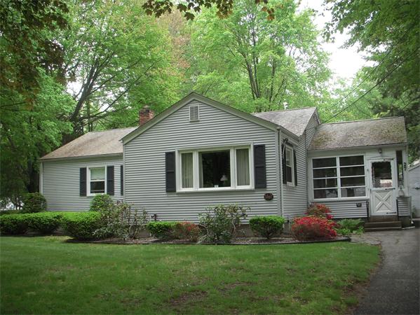 27 Greaney Street Springfield, MA 01104 - Photo 1 of 1 a front view of a house with a garden and porch