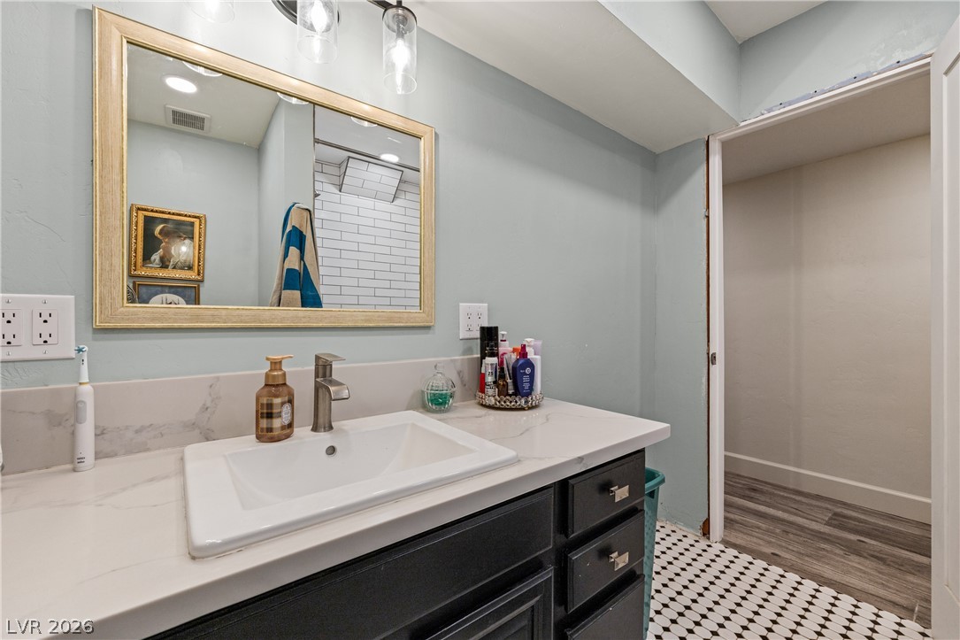 750 Leming Avenue Overton, NV 89040 - Photo 56 of 82 This bathroom features a contemporary vanity and an inviting, open entry to an adjacent space.