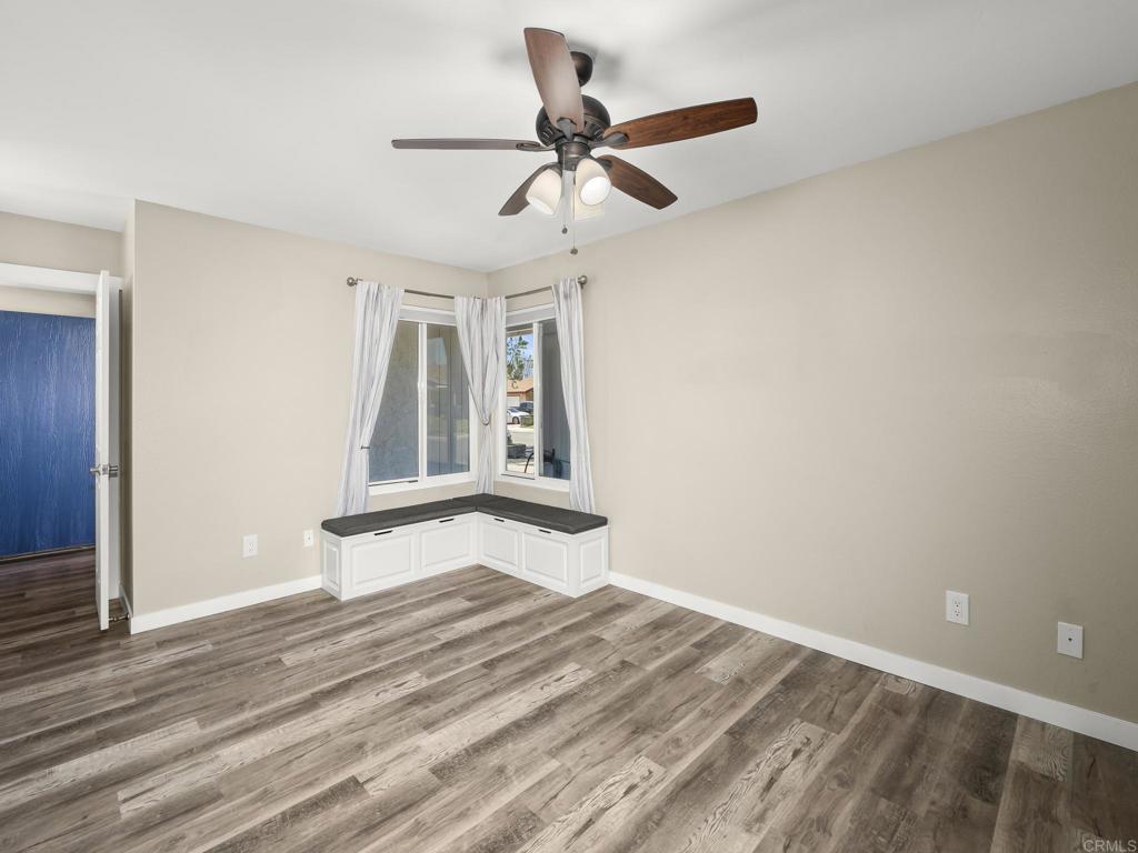 726 Fredricks Avenue Oceanside, CA 92058 - Photo 19 of 38 a view of empty room with wooden floor