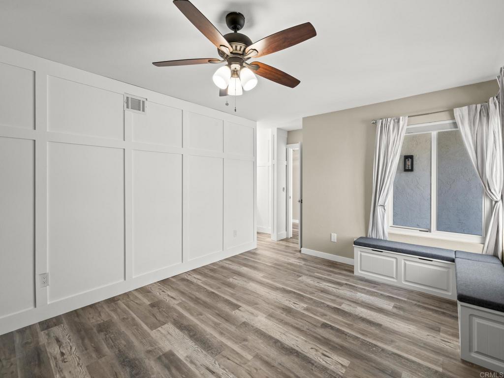 726 Fredricks Avenue Oceanside, CA 92058 - Photo 20 of 38 a view of empty room with wooden floor and fan