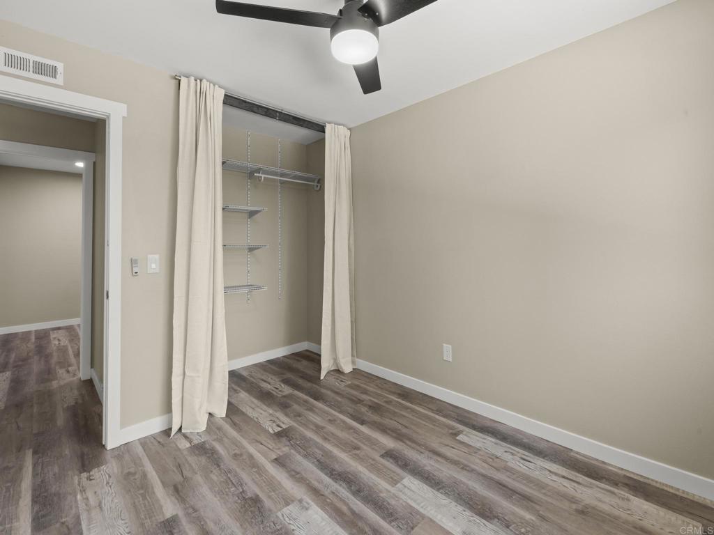 726 Fredricks Avenue Oceanside, CA 92058 - Photo 22 of 38 a view of a livingroom with wooden floor and closet
