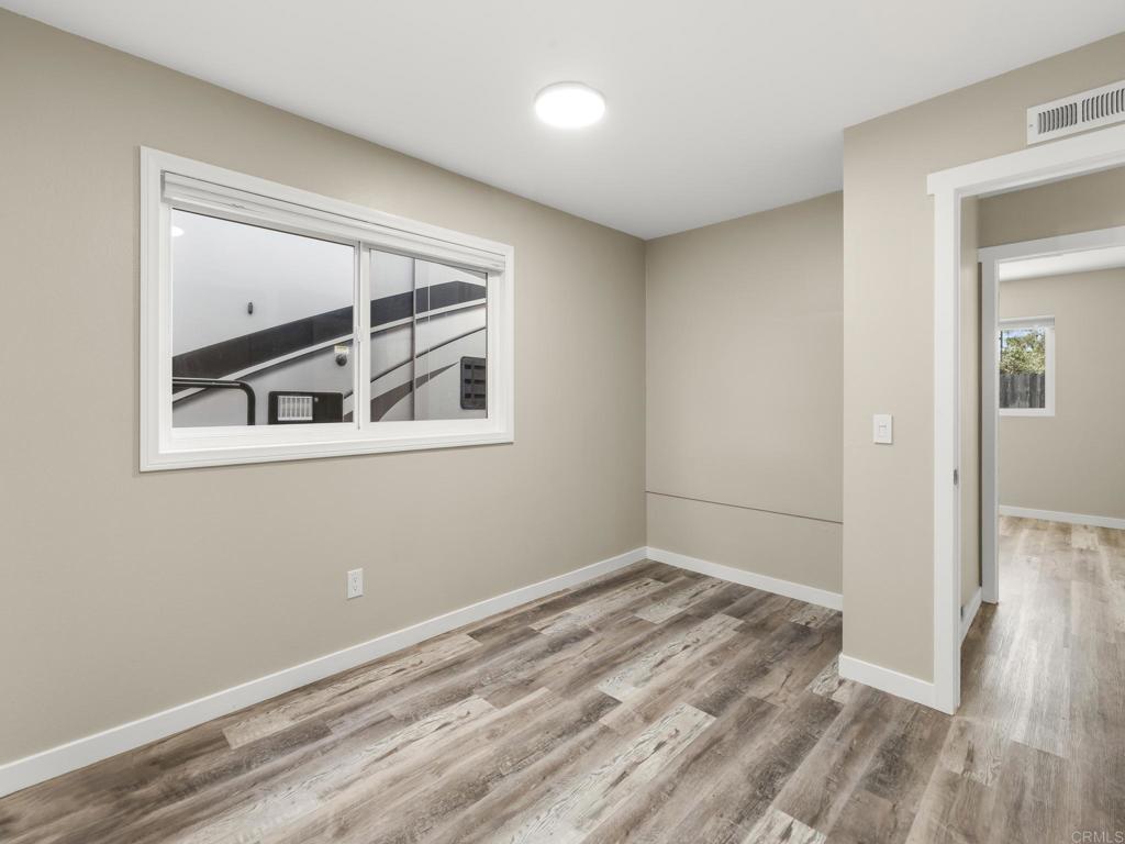 726 Fredricks Avenue Oceanside, CA 92058 - Photo 24 of 38 a view of empty room with wooden floor and fan