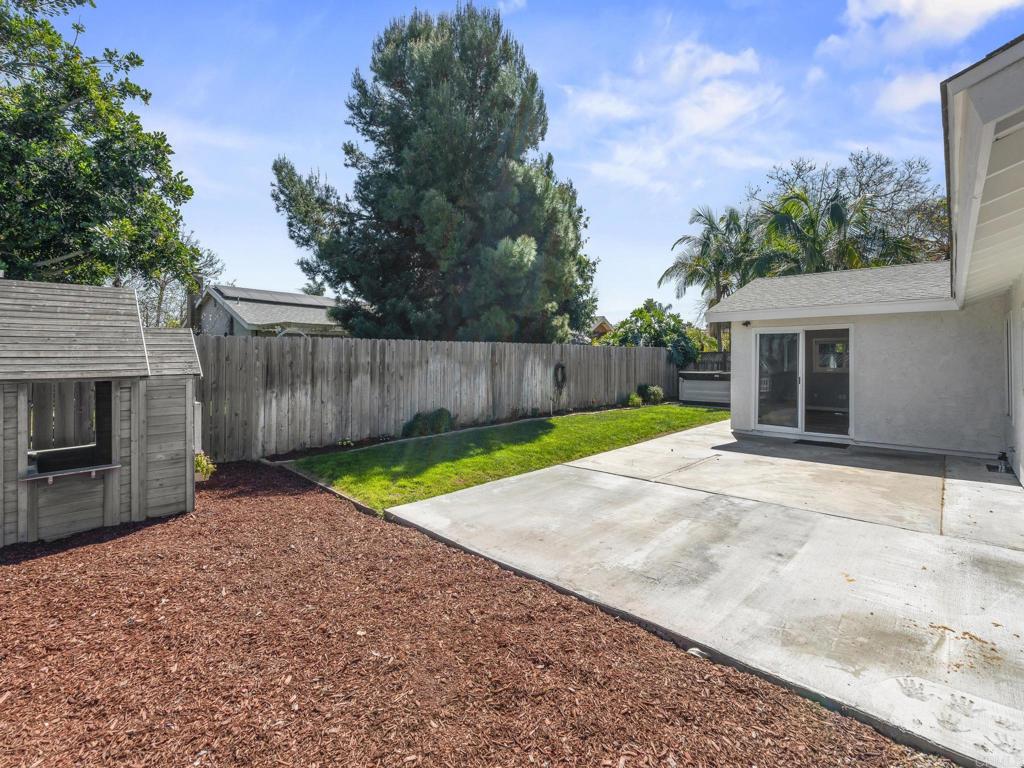 726 Fredricks Avenue Oceanside, CA 92058 - Photo 34 of 38 a view of a backyard with a garden and tree