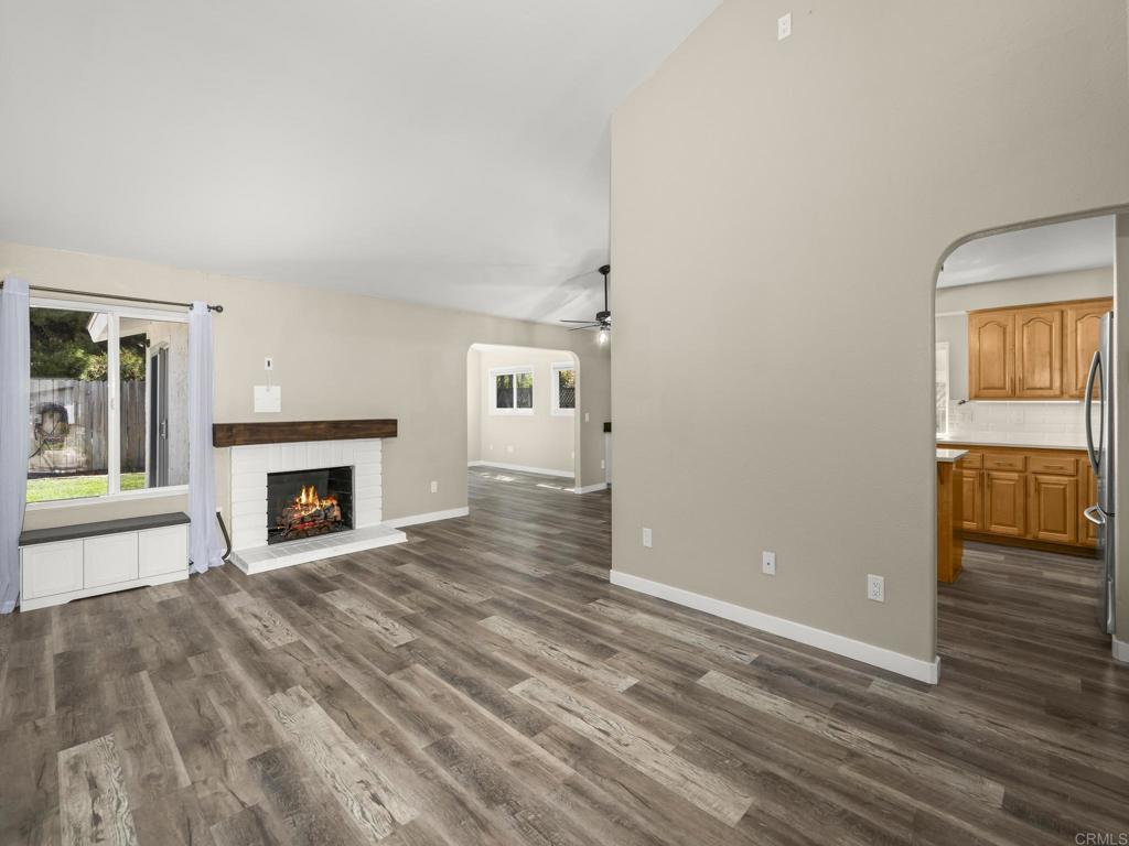 726 Fredricks Avenue Oceanside, CA 92058 - Photo 4 of 38 wooden floor fireplace and windows in an empty room
