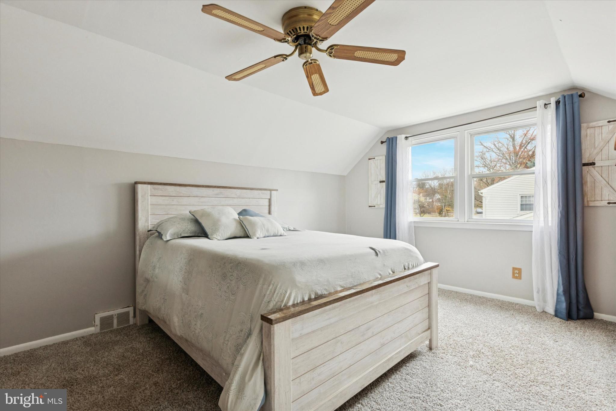 108 Devon Road Chalfont, PA 18914 - Photo 13 of 30 a bedroom with a bed and a chandelier