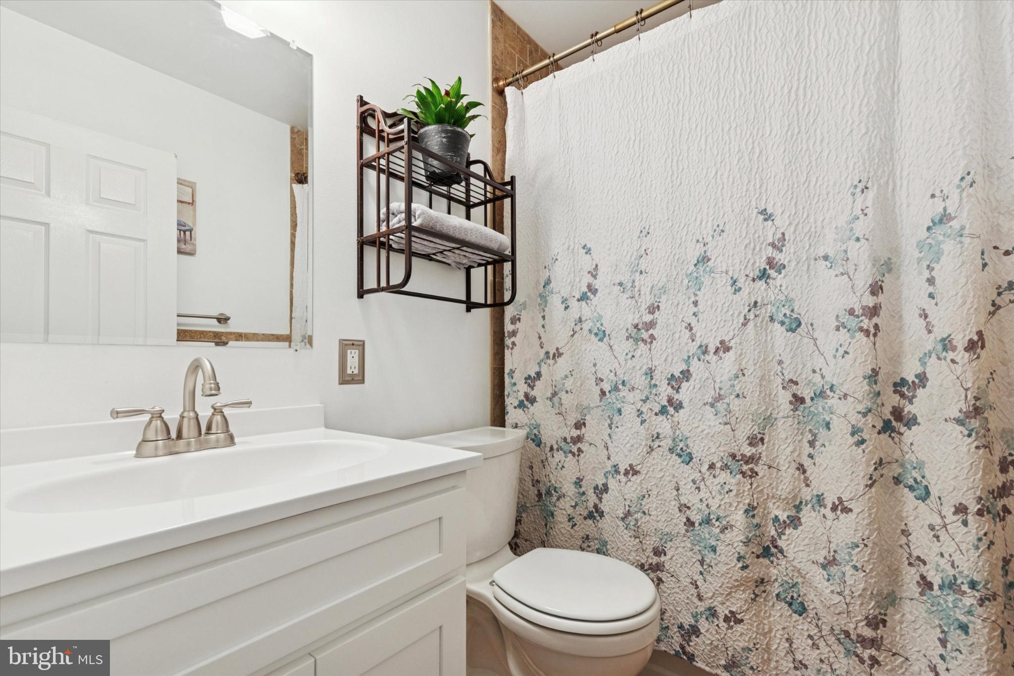 108 Devon Road Chalfont, PA 18914 - Photo 14 of 30 a bathroom with a toilet sink and mirror