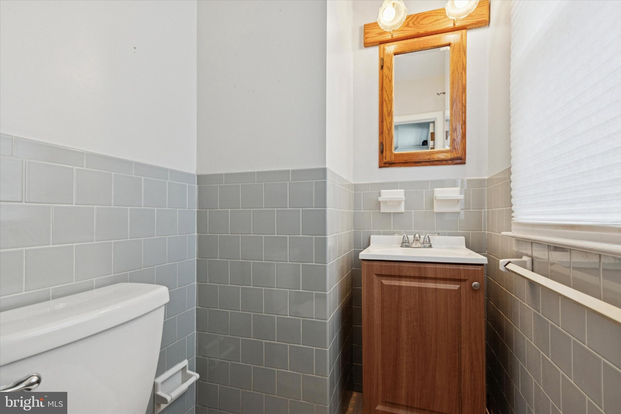 108 Devon Road Chalfont, PA 18914 - Photo 16 of 30 a bathroom with a toilet sink and mirror