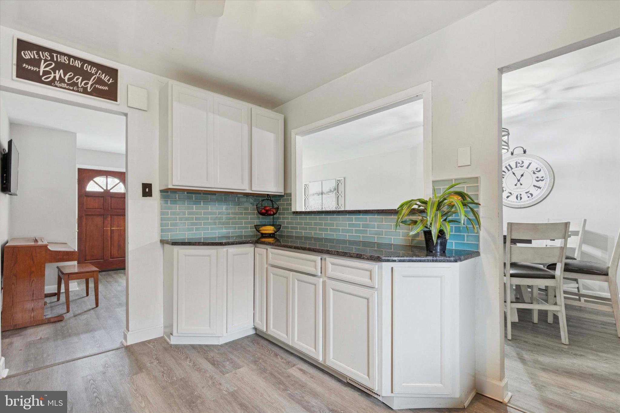 108 Devon Road Chalfont, PA 18914 - Photo 7 of 30 a kitchen with granite countertop a table and chairs in it