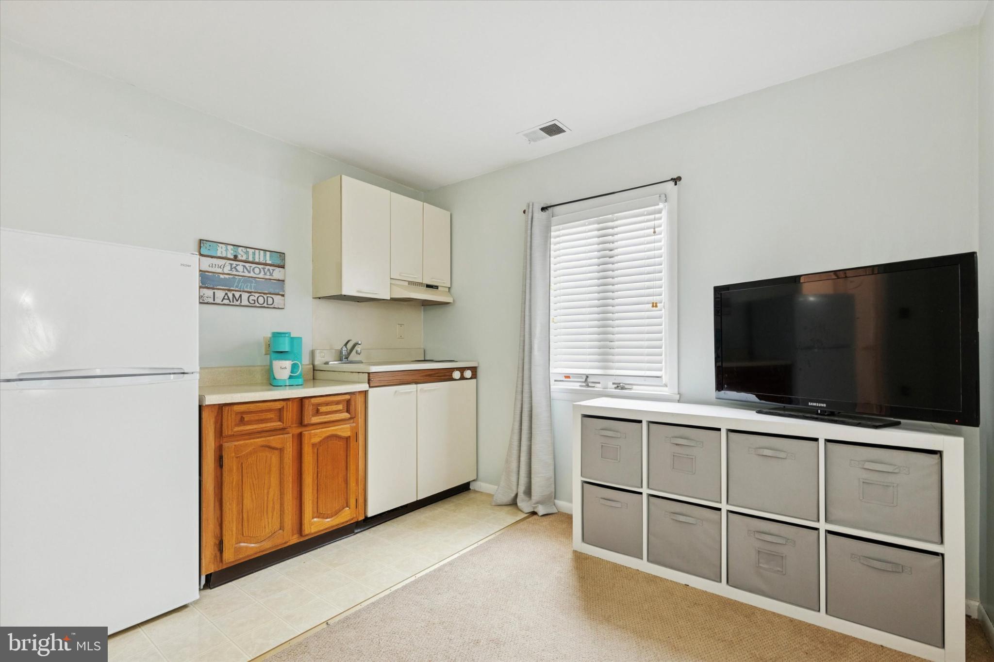 108 Devon Road Chalfont, PA 18914 - Photo 9 of 30 a open kitchen with white cabinets and white appliances