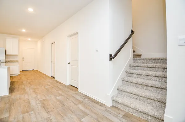 a view of a kitchen with a refrigerator