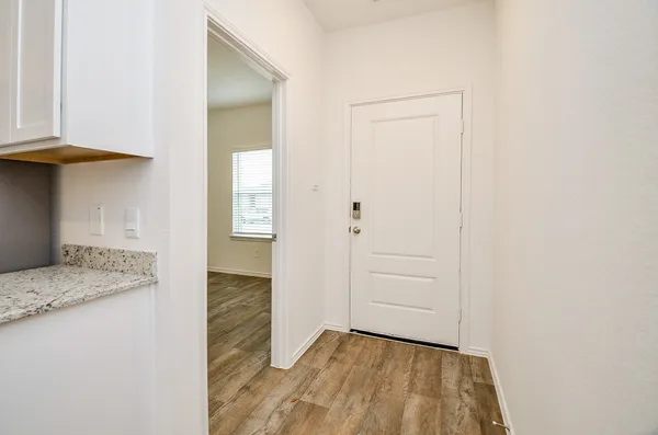 a kitchen with a sink stove and refrigerator