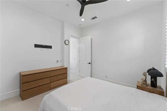 a bedroom with bed and window