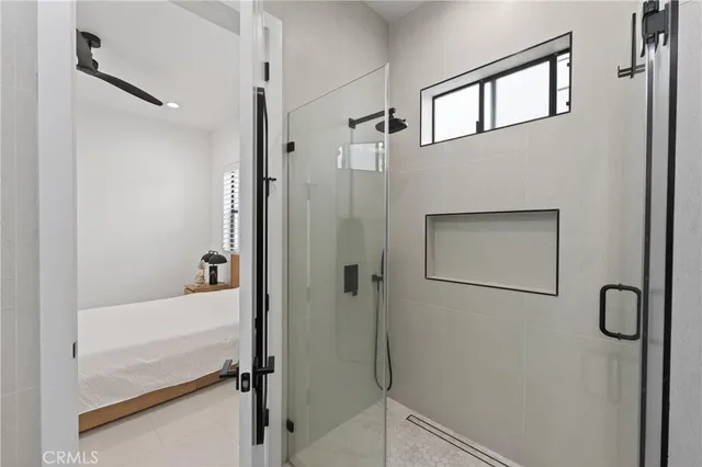 a bathroom with a bathtub and a shower