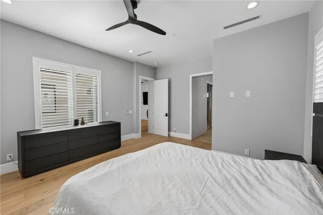 a bed room with a bed and a window