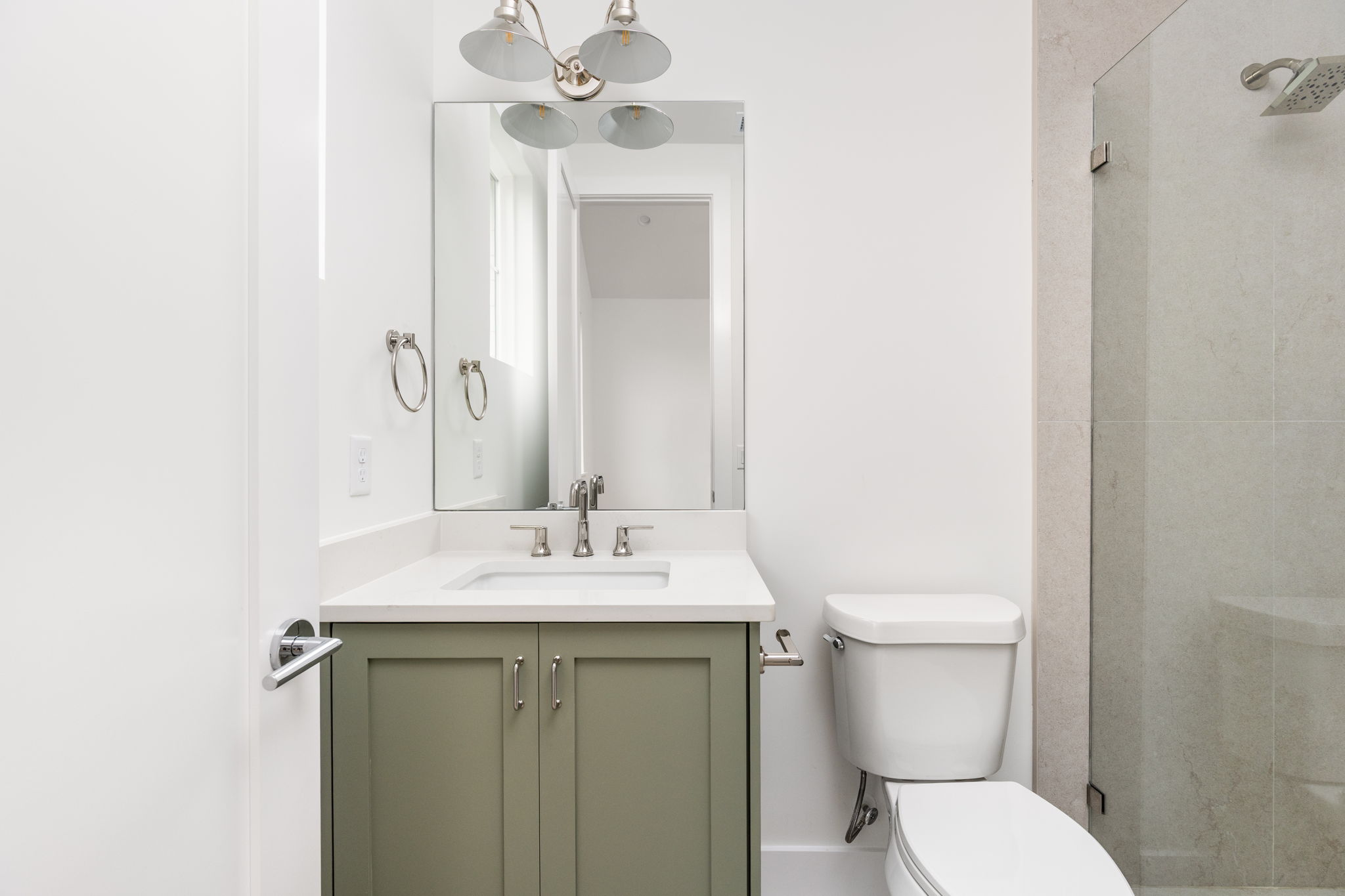 408 Linden Street, Unit B Austin, TX 78702 - Photo 22 of 40 Bathroom featuring vanity and a shower stall
