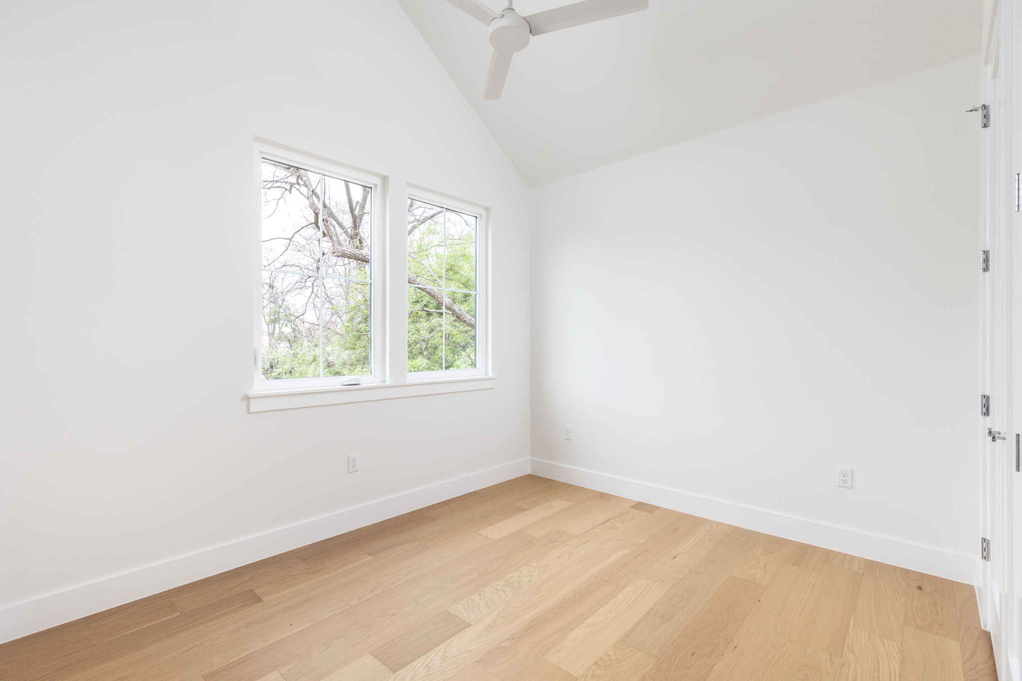 408 Linden Street, Unit B Austin, TX 78702 - Photo 32 of 40 Spare room featuring light wood finished floors, ceiling fan, and vaulted ceiling