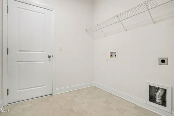 a kitchen with granite countertop kitchen island stainless steel appliances a sink stove and cabinets