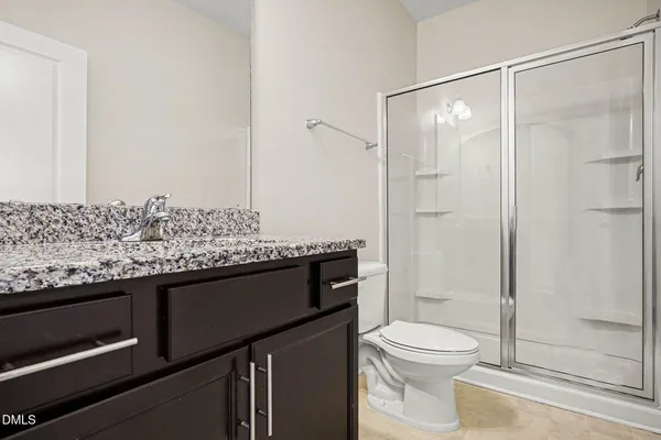 a large kitchen with a sink and stainless steel appliances