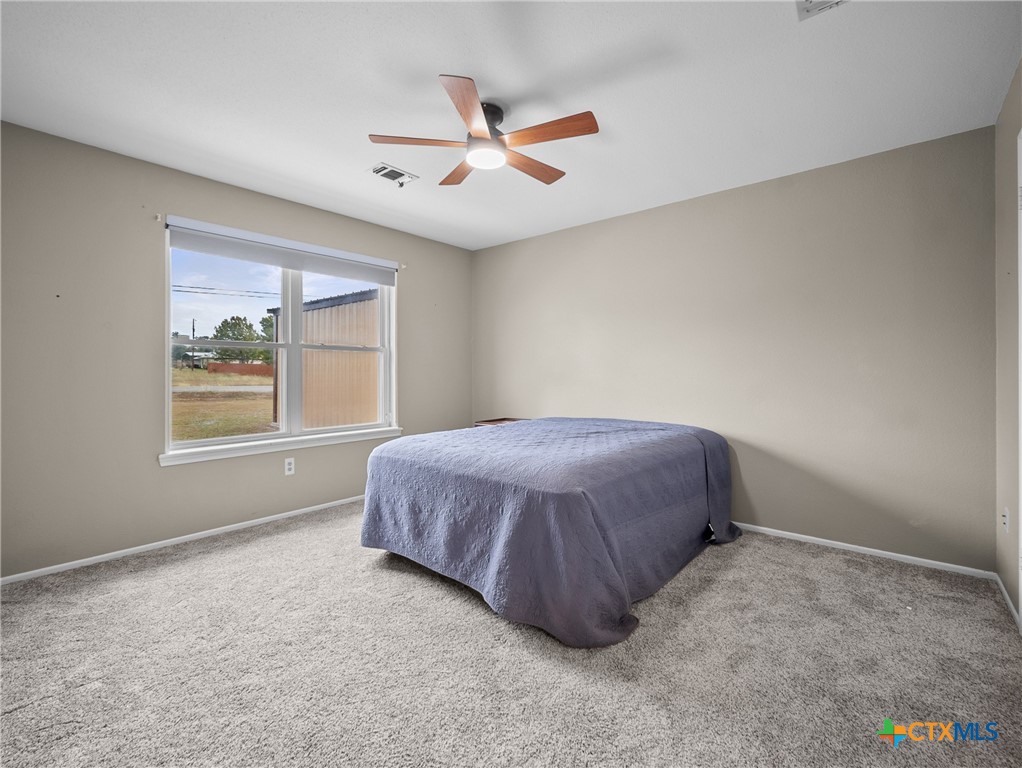 782 Santa Clara Loop Marion, TX 78124 - Photo 48 of 48 a spacious bedroom with a bed and window