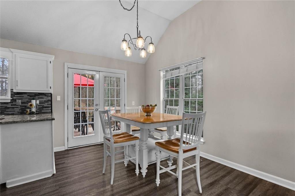 304 Ridge Hill Circle Canton, GA 30115 - Photo 11 of 42 a view of a dining room with furniture wooden floor and chandelier
