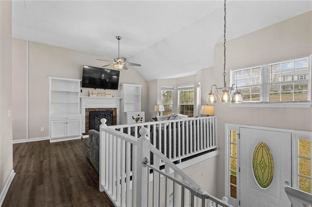 304 Ridge Hill Circle Canton, GA 30115 - Photo 16 of 42 a living room with furniture a fireplace and a flat screen tv