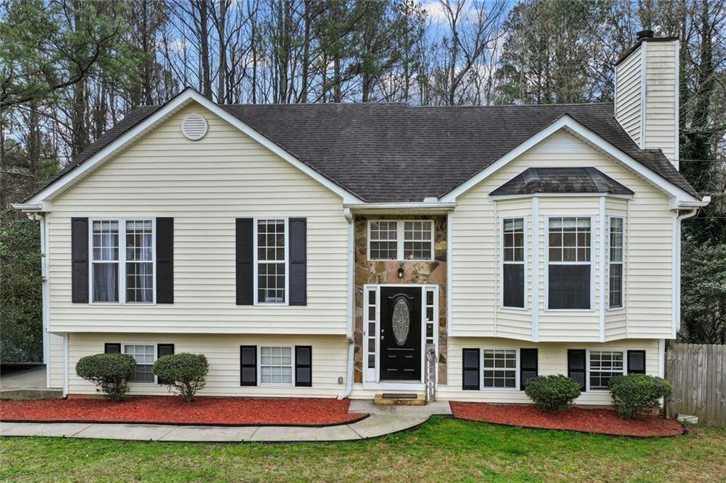 304 Ridge Hill Circle Canton, GA 30115 - Photo 2 of 42 a view of a house with a yard and plants