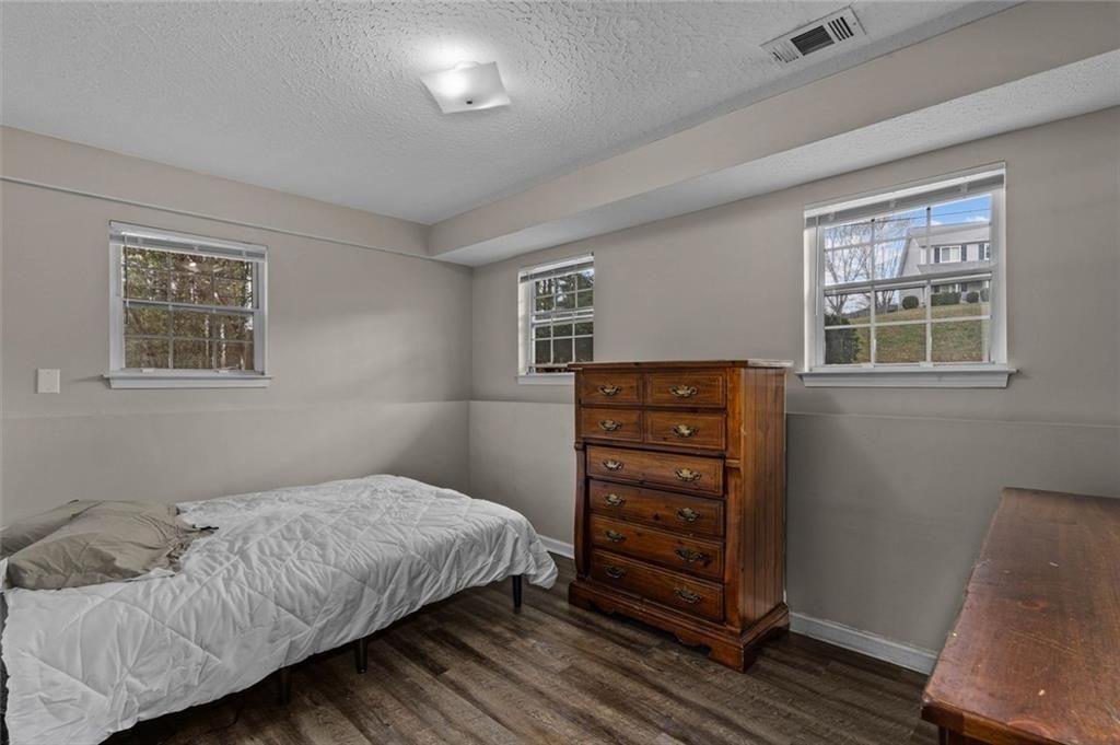 304 Ridge Hill Circle Canton, GA 30115 - Photo 24 of 42 a bedroom with a bed and a window