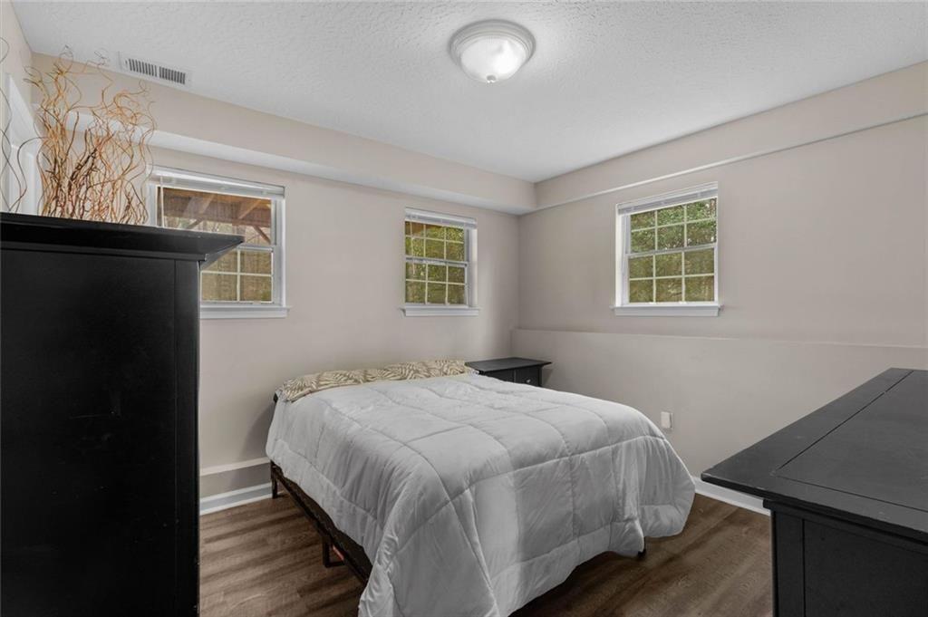 304 Ridge Hill Circle Canton, GA 30115 - Photo 25 of 42 a bedroom with a bed and a desk