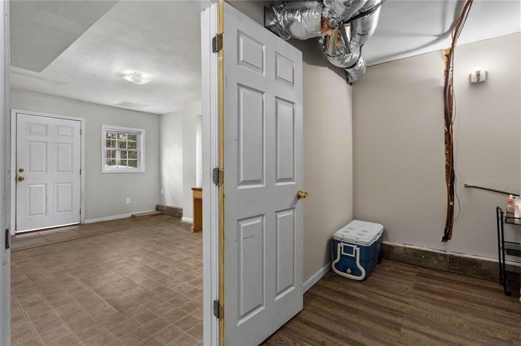 304 Ridge Hill Circle Canton, GA 30115 - Photo 29 of 42 a view of a hallway with wooden floor and staircase