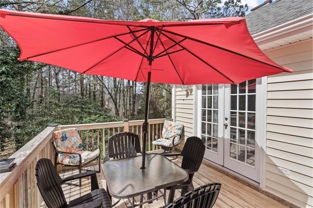 304 Ridge Hill Circle Canton, GA 30115 - Photo 31 of 42 a view of balcony with a table and chairs under an umbrella