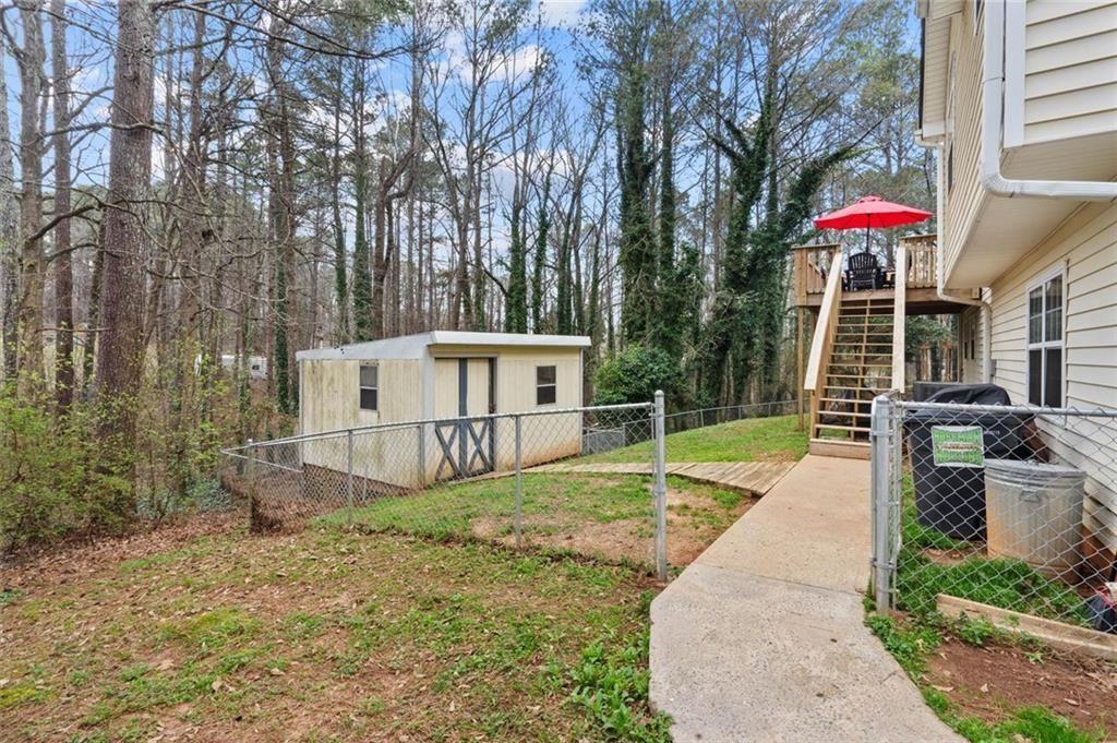 304 Ridge Hill Circle Canton, GA 30115 - Photo 33 of 42 a view of a house with backyard and sitting area