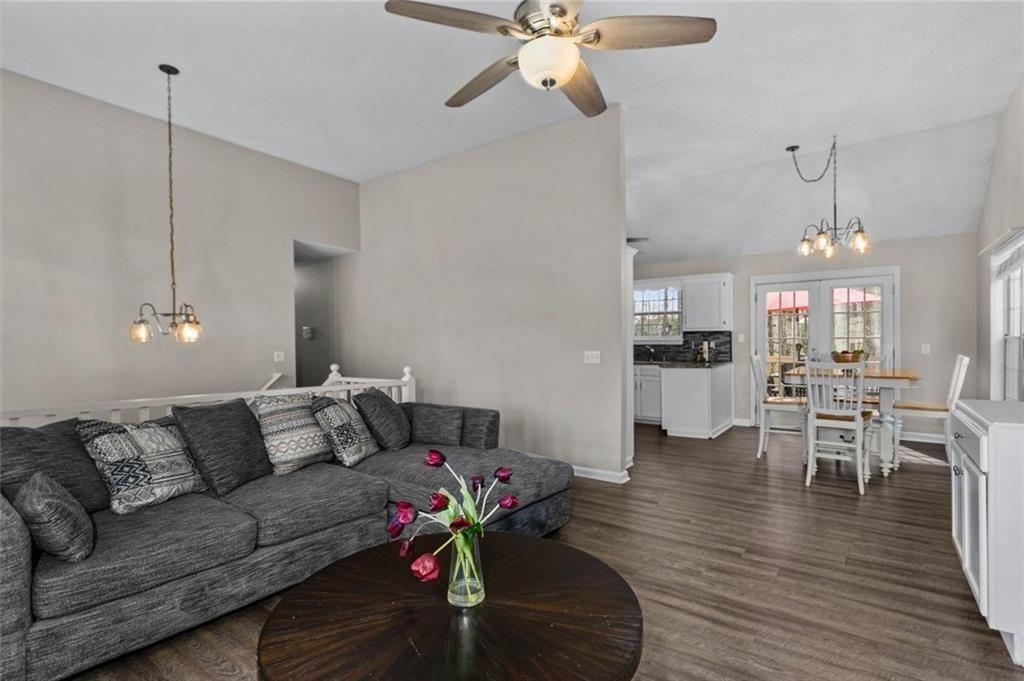 304 Ridge Hill Circle Canton, GA 30115 - Photo 10 of 42 a living room with furniture kitchen view and a chandelier