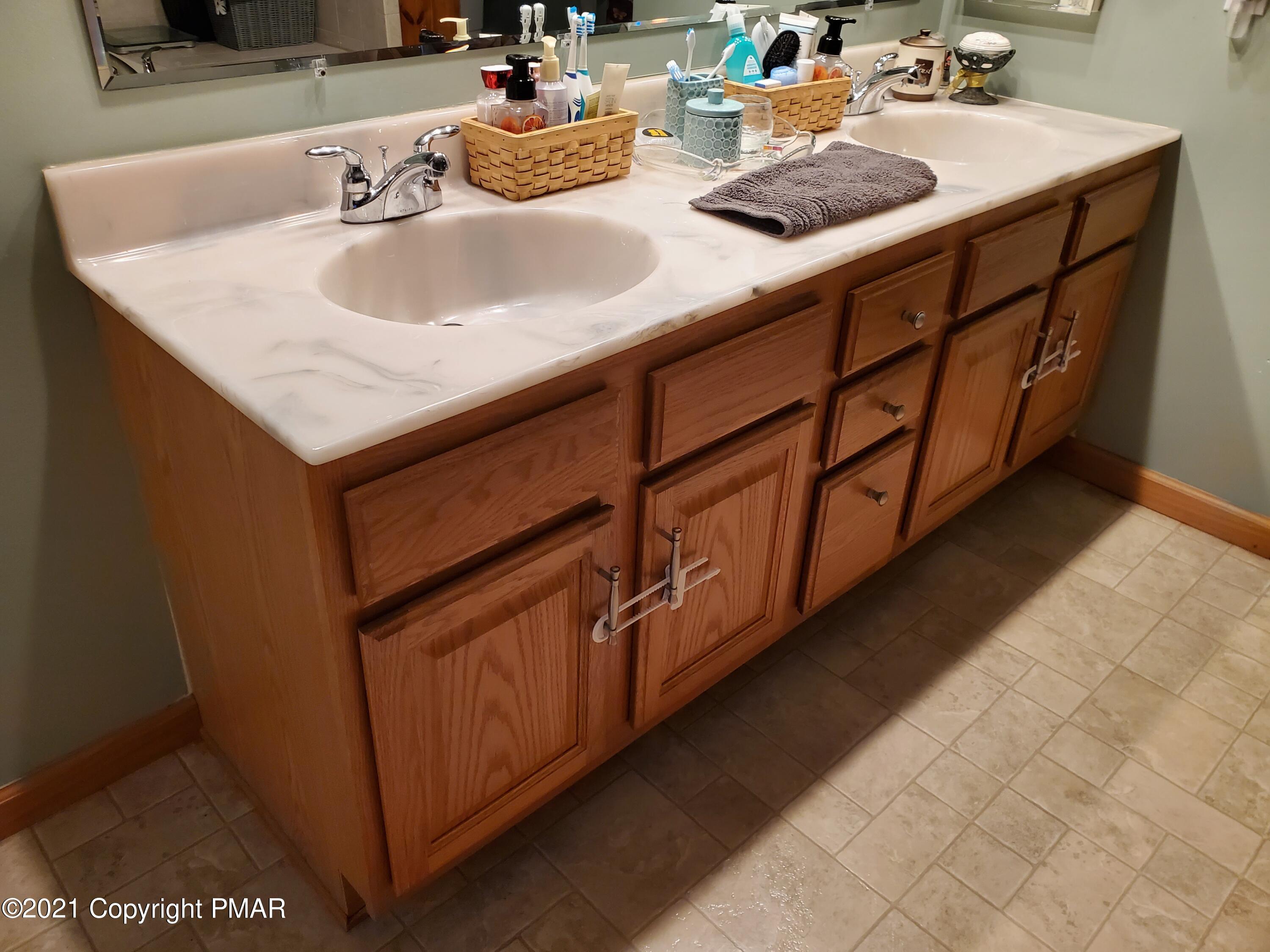 590 Henry's Crossing Road Cresco, PA 18326 - Photo 11 of 31 a bathroom with sink and washing machine