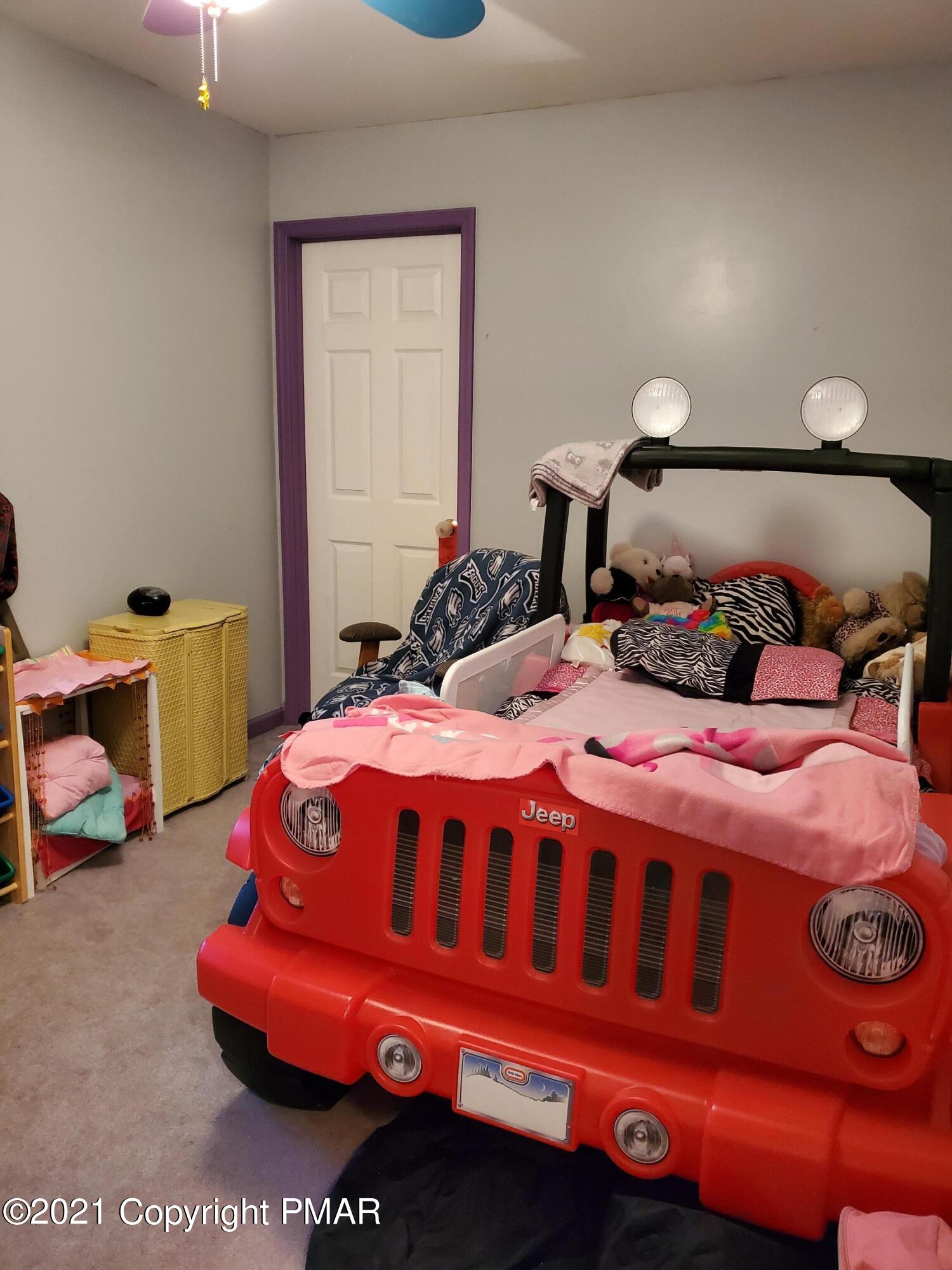 590 Henry's Crossing Road Cresco, PA 18326 - Photo 16 of 31 a bedroom with a bed and a window