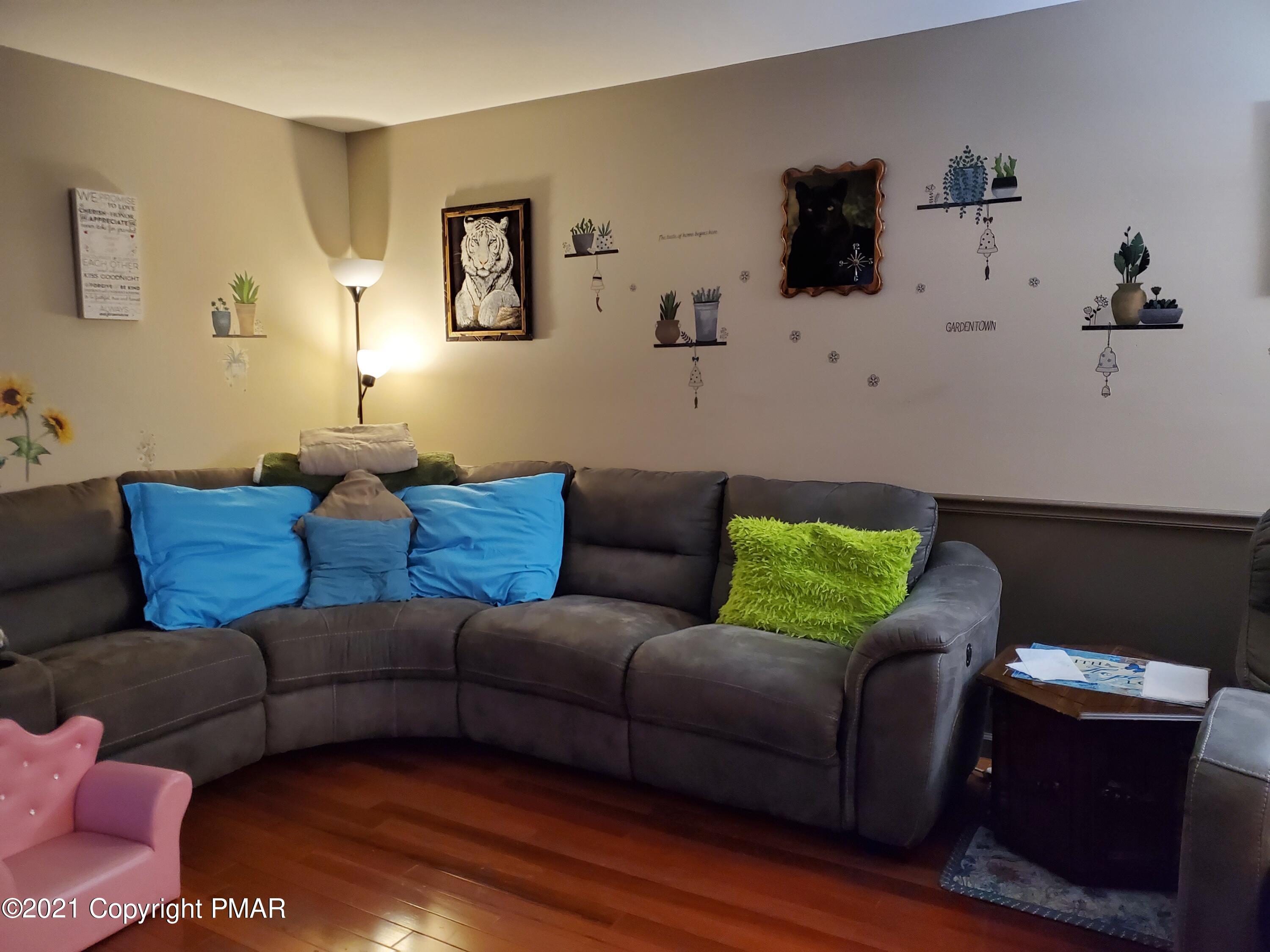 590 Henry's Crossing Road Cresco, PA 18326 - Photo 17 of 31 a living room with furniture and a couch
