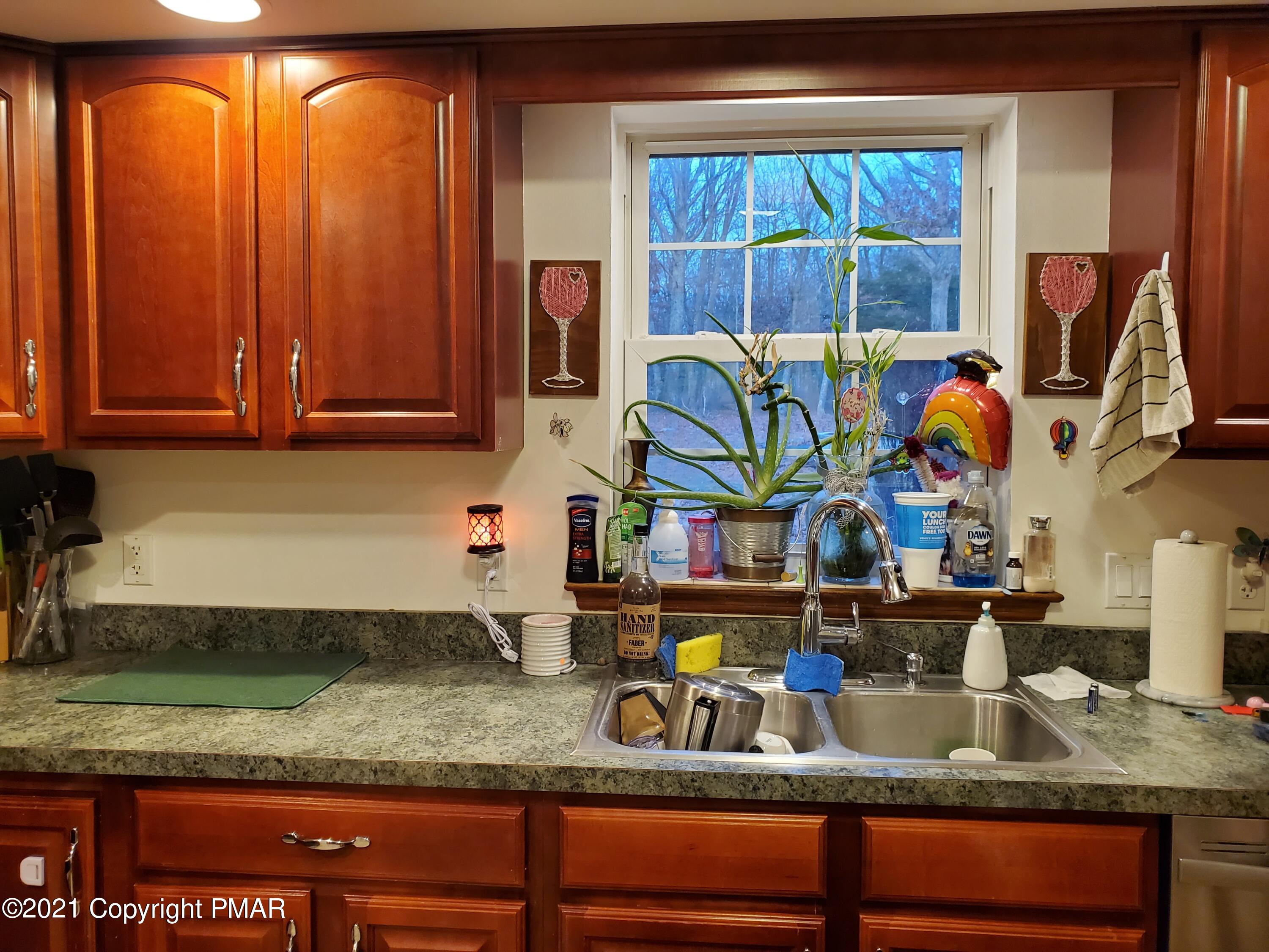 590 Henry's Crossing Road Cresco, PA 18326 - Photo 18 of 31 a kitchen with sink and window