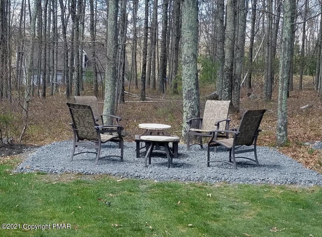 590 Henry's Crossing Road Cresco, PA 18326 - Photo 25 of 31 a view of a outdoor sitting area with chairs