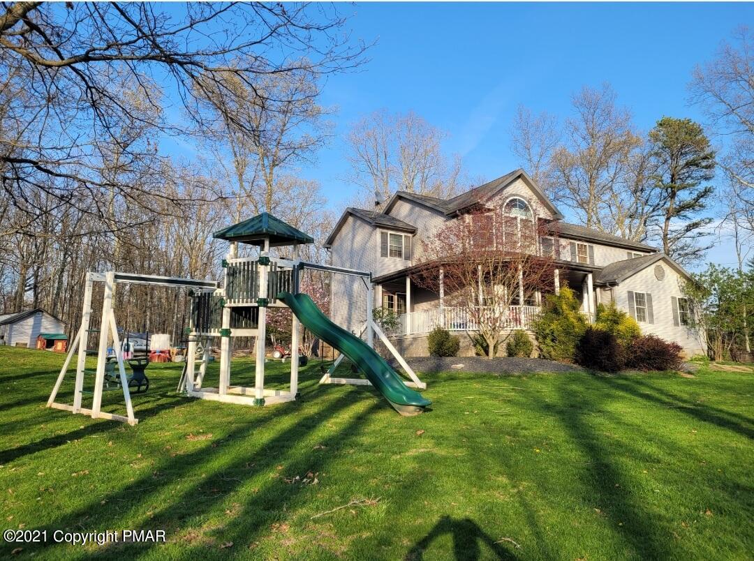 590 Henry's Crossing Road Cresco, PA 18326 - Photo 28 of 31 a view of a house with a yard
