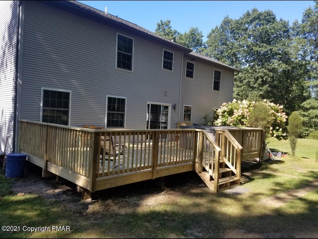 590 Henry's Crossing Road Cresco, PA 18326 - Photo 29 of 31 a view of backyard with deck and a garden