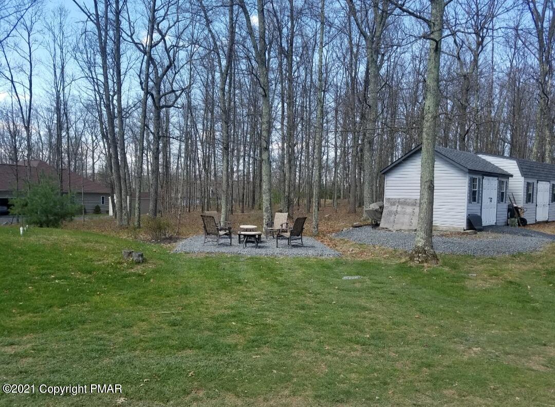 590 Henry's Crossing Road Cresco, PA 18326 - Photo 31 of 31 a view of a house with backyard and sitting area