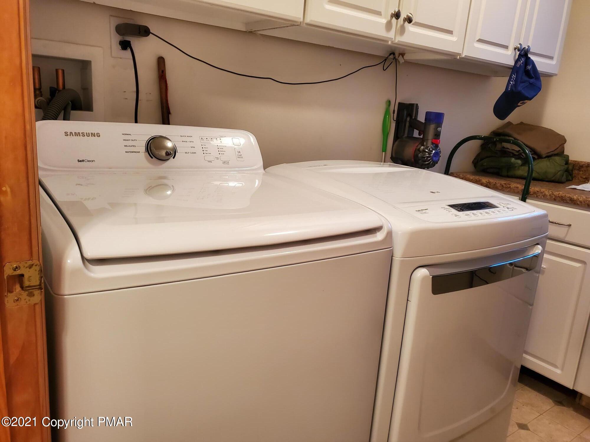 590 Henry's Crossing Road Cresco, PA 18326 - Photo 10 of 31 a utility room with dryer and washer
