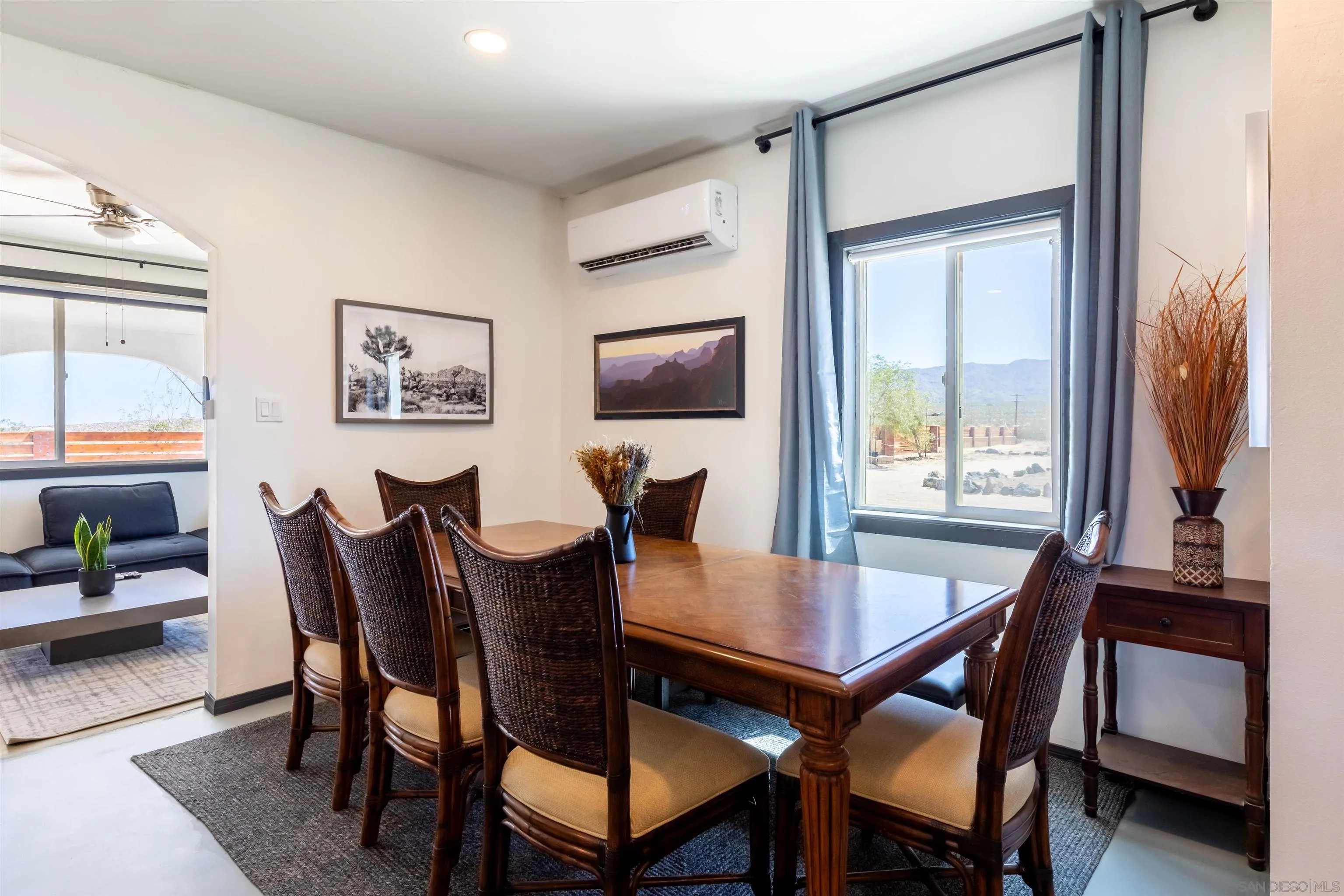 5066 Lear Avenue Twentynine Palms, CA 92277 - Photo 13 of 69 a view of a dining room with furniture and a potted plant