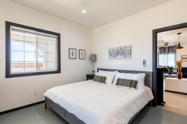 a bathroom with a sink toilet a mirror and shower