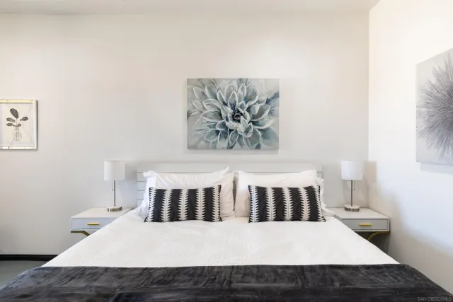 a bedroom with furniture and a window