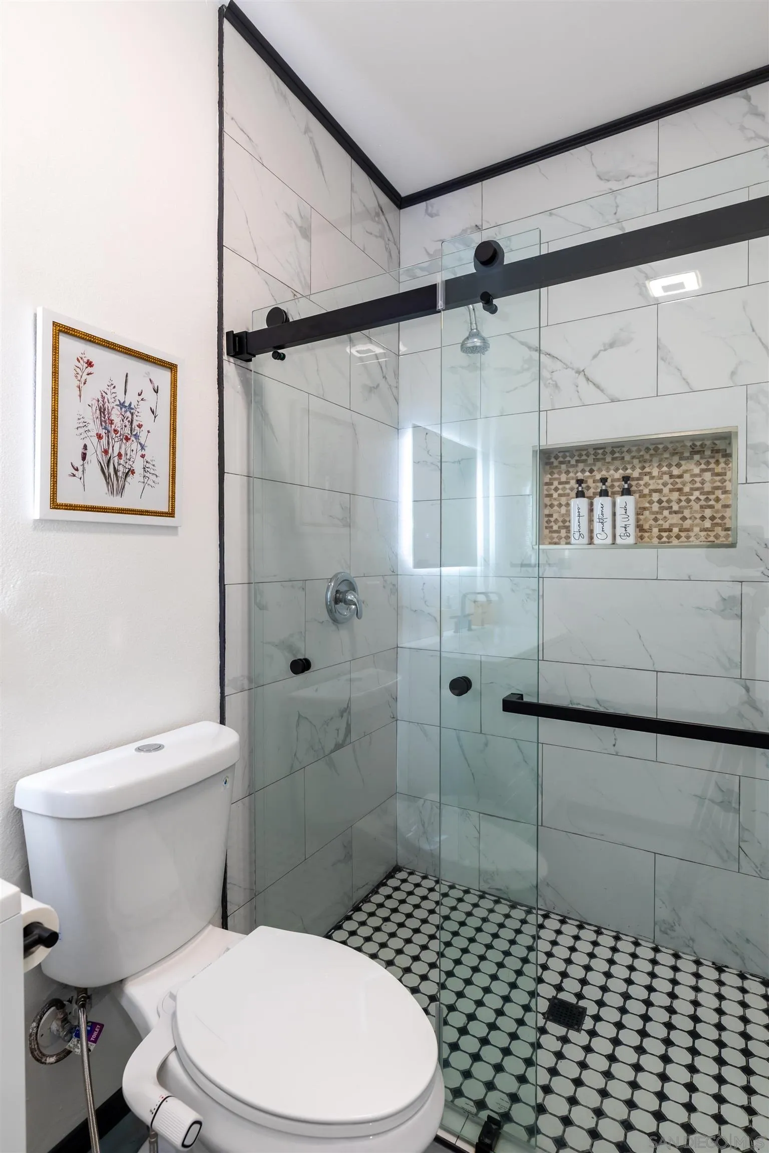 5066 Lear Avenue Twentynine Palms, CA 92277 - Photo 26 of 69 a white toilet sitting next to a bathroom sink