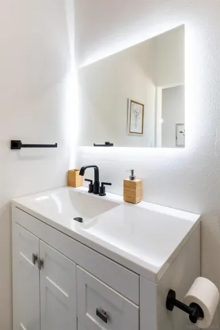 a bedroom with furniture and a window