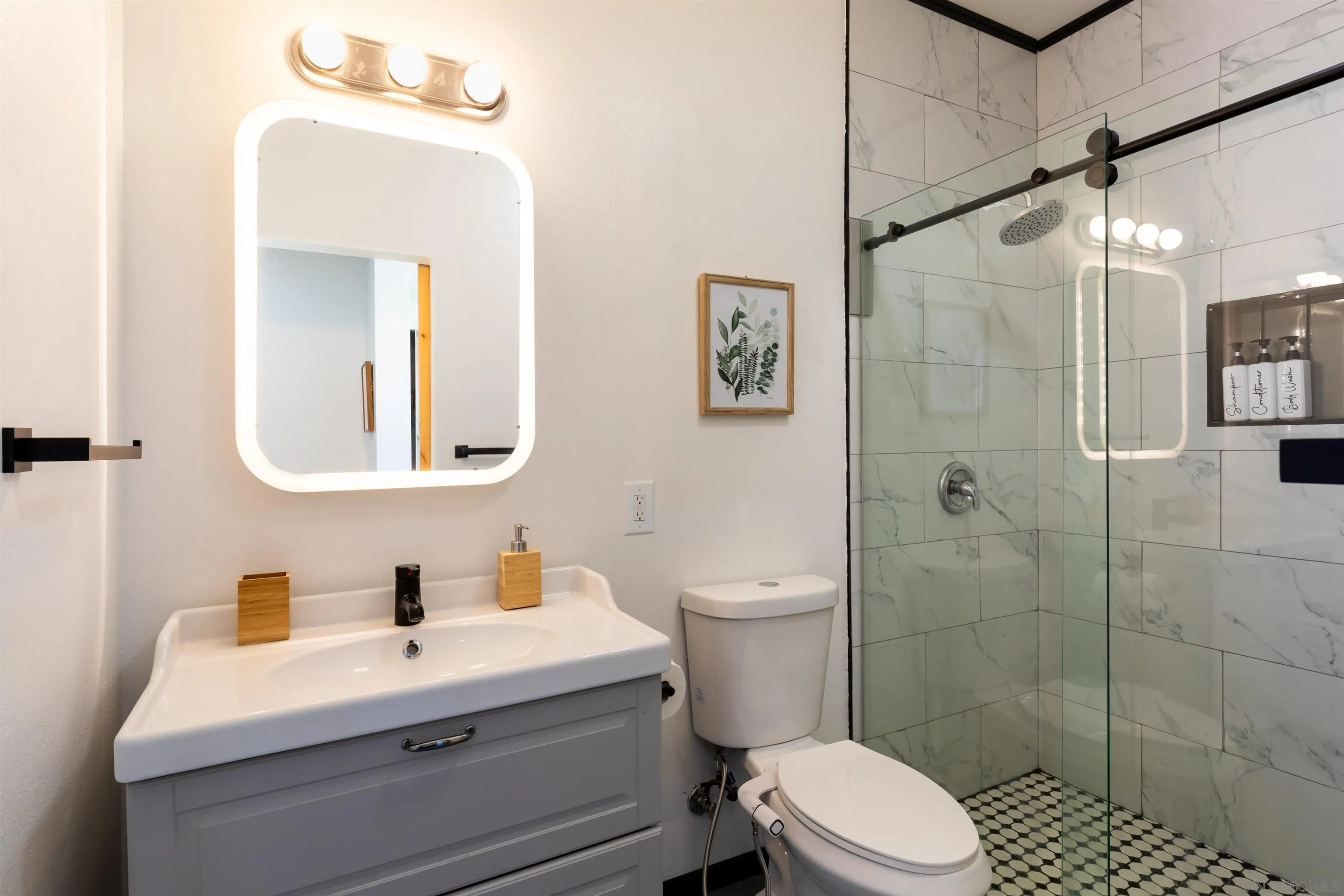 5066 Lear Avenue Twentynine Palms, CA 92277 - Photo 32 of 69 a bathroom with a sink mirror vanity and toilet