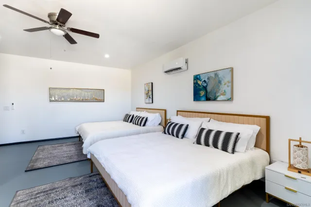 a bathroom with a sink toilet a mirror and shower